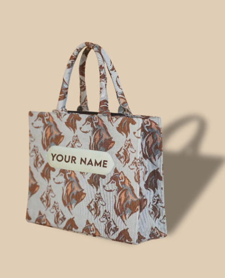 A custom made Jacquard tote bag with a golden floral pattern